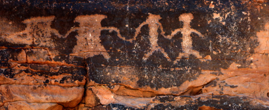 Native American Petroglyphs in Red Sandstone From the Southweste