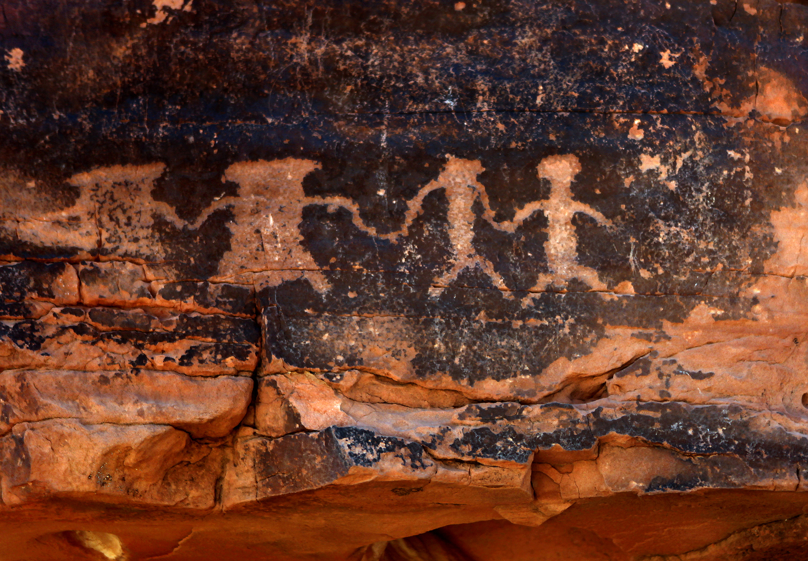 Native American Petroglyphs in Red Sandstone From the Southweste